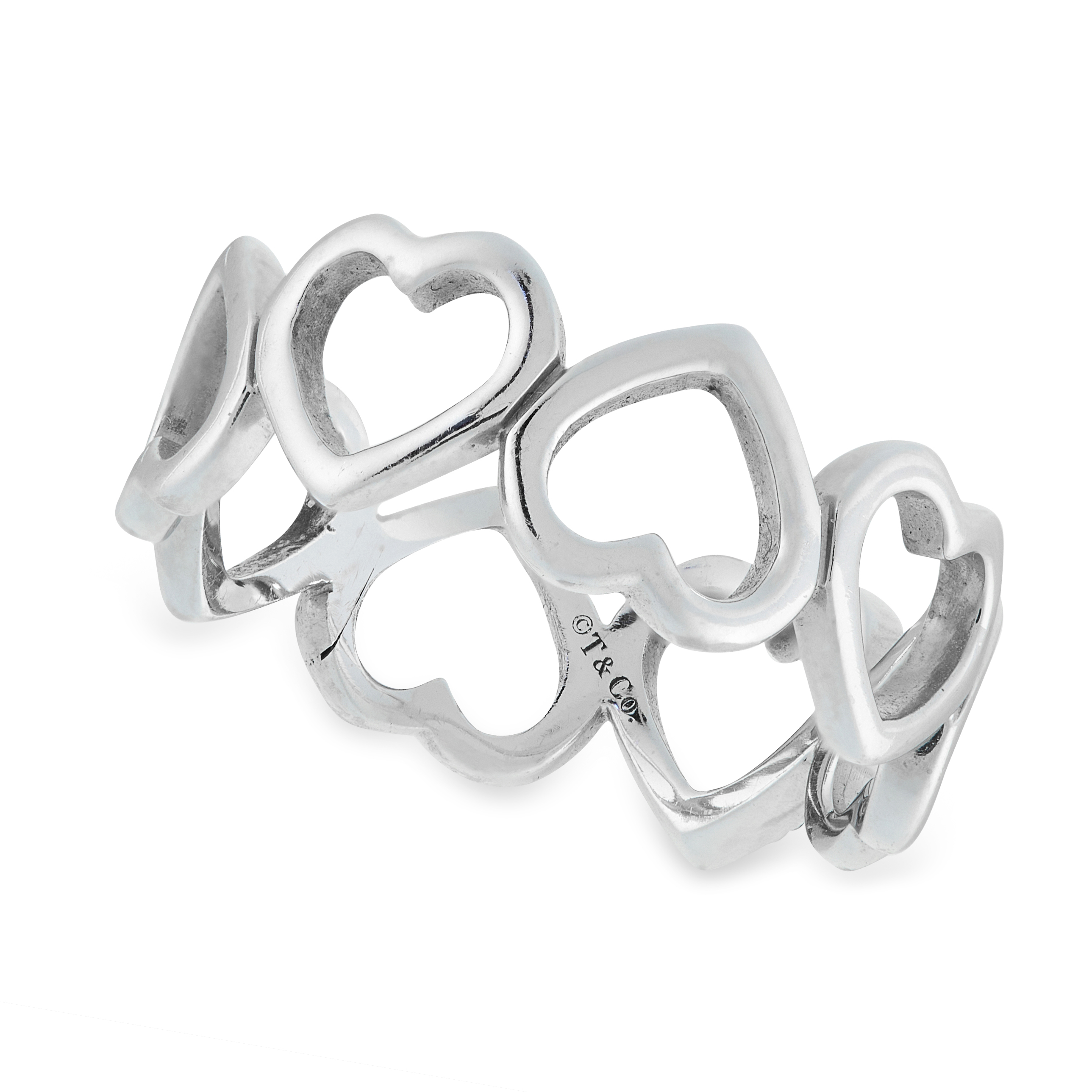 A DIAMOND HEART RING, TIFFANY & CO in 18ct white gold, the band formed of a row of eight hearts, one - Image 2 of 2