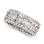 A DIAMOND ETERNITY RING in 18ct white gold, set with a central row of baguette cut diamonds