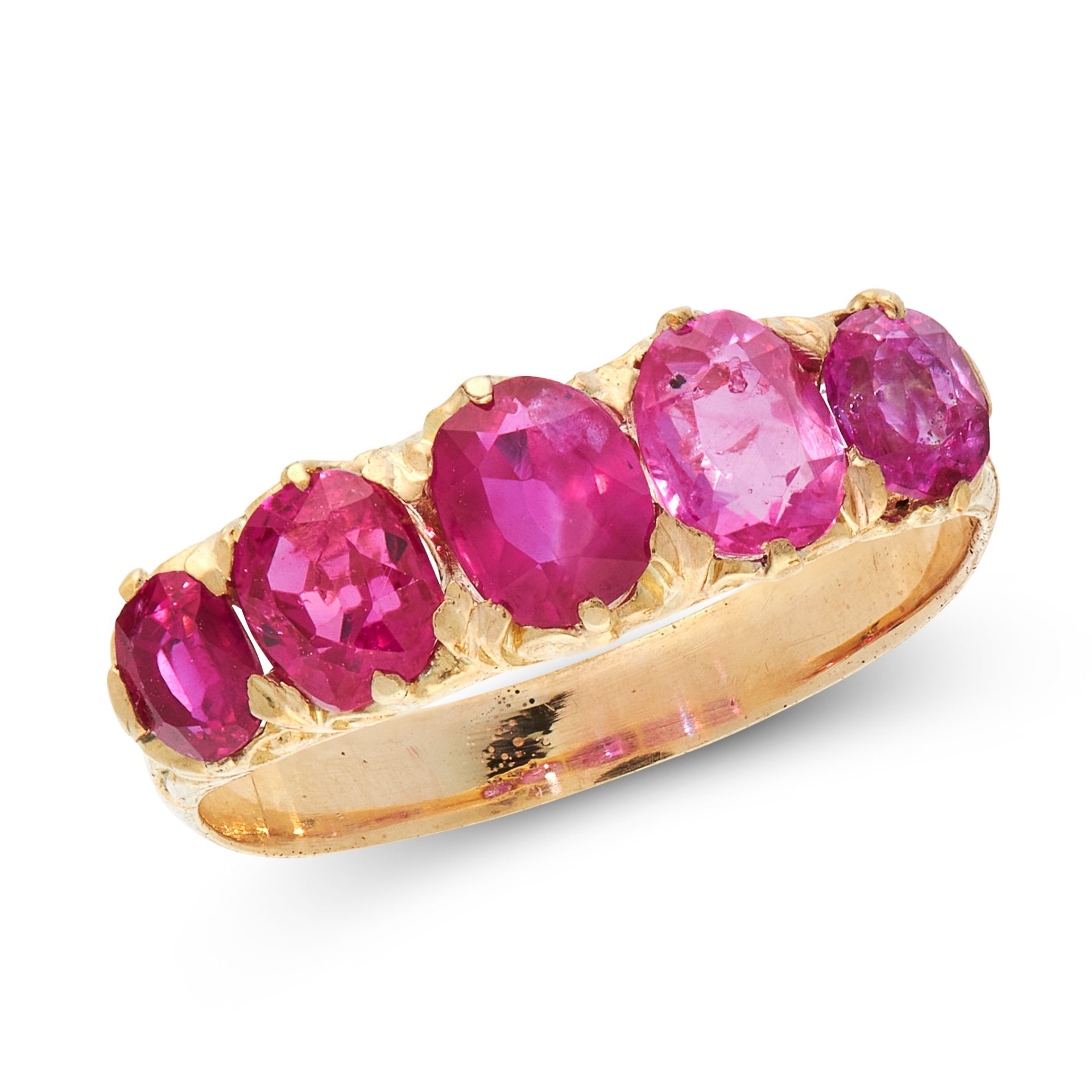 A BURMA NO HEAT RUBY THREE STONE RING in high carat yellow gold, set with a row of five graduated