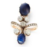 A SAPPHIRE AND DIAMOND DRESS RING, EARLY 20TH CENTURY in high carat yellow gold, set with two oval