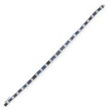 A SAPPHIRE AND DIAMOND LINE BRACELET comprising a row of twenty one graduated step cut blue
