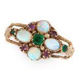 AN ANTIQUE EMERALD, OPAL AND GARNET DRESS RING, 19TH CENTURY in yellow gold, set with a trio of