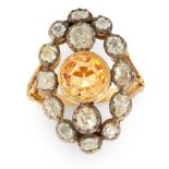 AN ANTIQUE IMPERIAL TOPAZ AND DIAMOND RING in high carat yellow gold and silver, set with a round