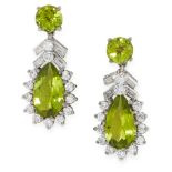A PAIR OF PERIDOT AND DIAMOND EARRINGS in 18ct white gold, each set with a pear cut peridot within a