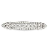 A DIAMOND BROOCH in white gold, the elongated oval body set with a row of seven principal old