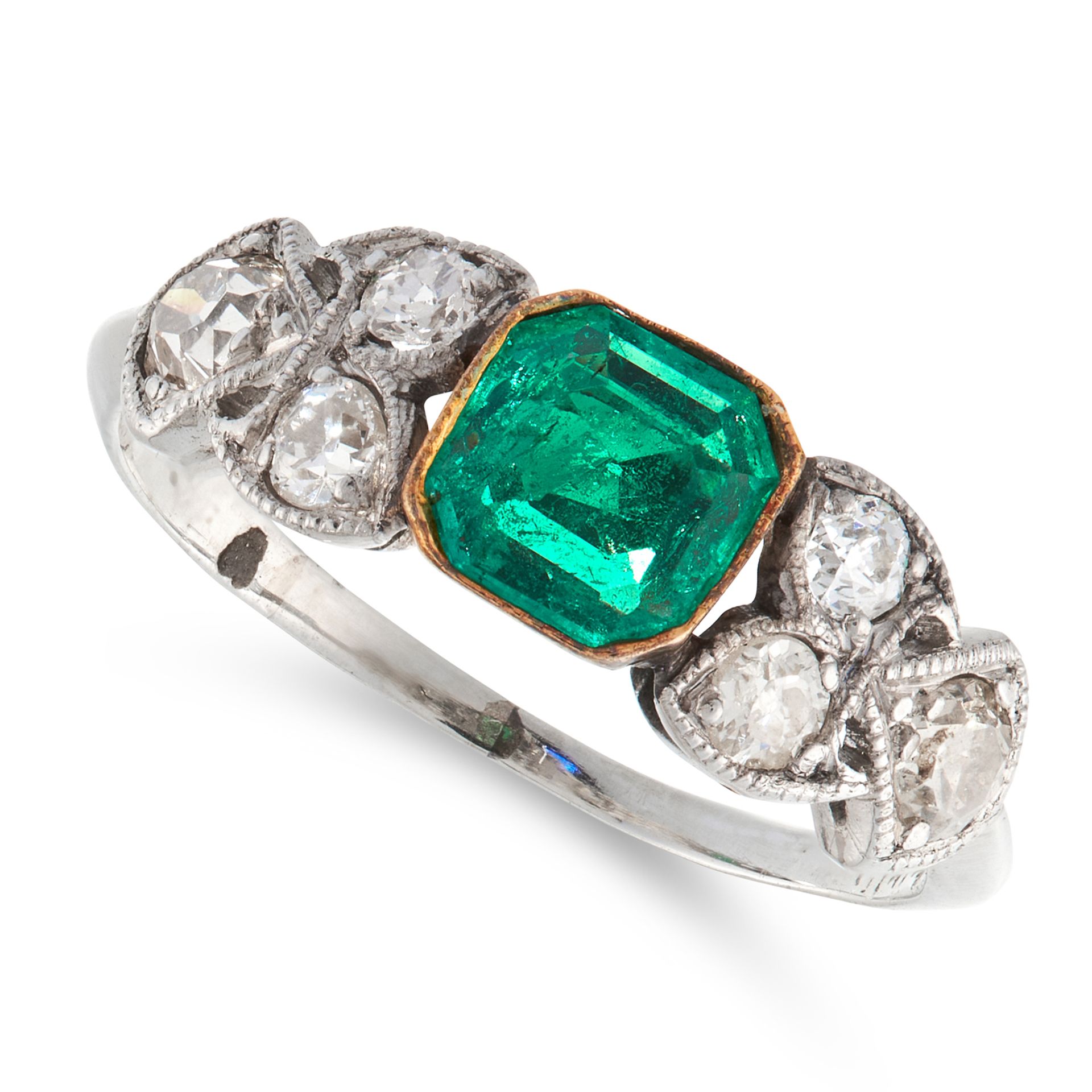 AN EMERALD AND DIAMOND DRESS RING in platinum, set with an emerald cut emerald of 0.37 carats