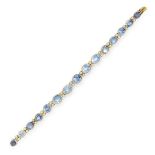 A SAPPHIRE AND DIAMOND BRACELET in high carat yellow gold, comprising a row of fifteen graduated