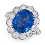 A BURMA NO HEAT SAPPHIRE AND DIAMOND CLUSTER RING set with a cushion cut sapphire of 4.96 carats,