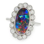A BLACK OPAL AND DIAMOND DRESS RING, EARLY 20TH CENTURY in platinum, set with an oval cabochon black
