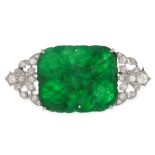 A NATURAL JADEITE JADE AND DIAMOND BROOCH in white gold, set with a cushion shaped piece of polished