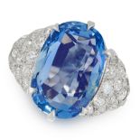 A CEYLON NO HEAT SAPPHIRE AND DIAMOND RING set with a cushion cut sapphire of 8.46 carats, between