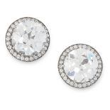 A PAIR OF DIAMOND STUD EARRINGS in platinum, each set with an old round cut diamond of 3.11 and 2.96