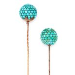 A PAIR OF ANTIQUE TURQUOISE HAT PINS in yellow gold, each pin is set with a sphere, set with