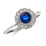 A SAPPHIRE AND DIAMOND RING in 18ct white gold and platinum, set with a round cut sapphire of 0.75