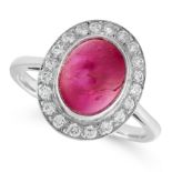 A RUBY AND DIAMOND CLUSTER RING set with an oval cabochon ruby of 3.99 carats within a border of