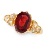 AN ANTIQUE GARNET AND DIAMOND RING, 19TH CENTURY in 18ct yellow gold, set with an oval cut almandine