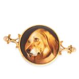 AN ANTIQUE DOG MINIATURE LOCKET BROOCH in yellow gold, the circular face with a miniature