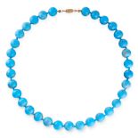 A TURQUOISE BEAD NECKLACE comprising of a single row of thirty three turquoise beads, unmarked,