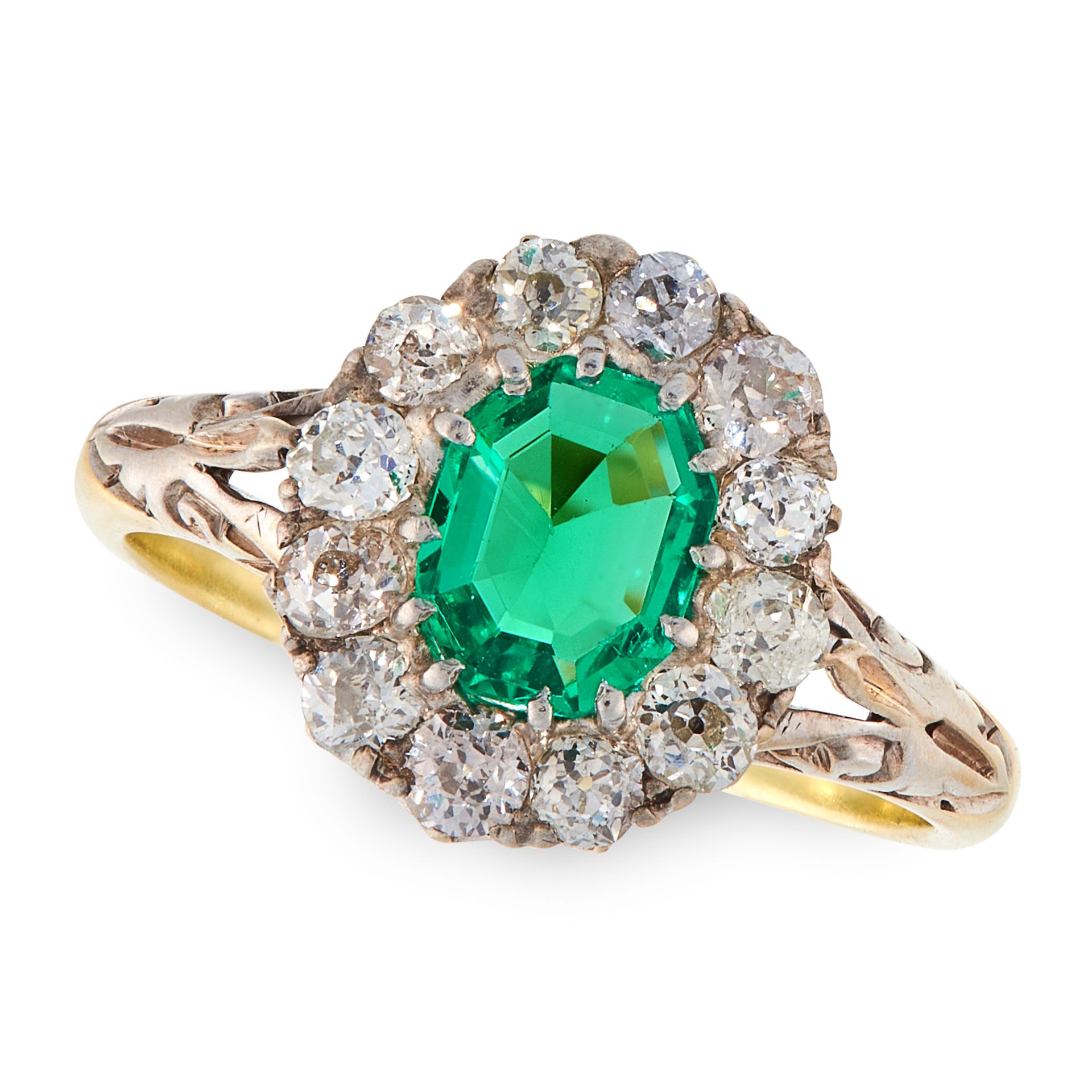 A COLOMBIAN EMERALD AND DIAMOND RING in high carat yellow gold, set with an emerald cut emerald of