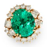 AN IMPORTANT COLOMBIAN EMERALD AND DIAMOND CLUSTER RING in yellow gold, set with an oval cut emerald