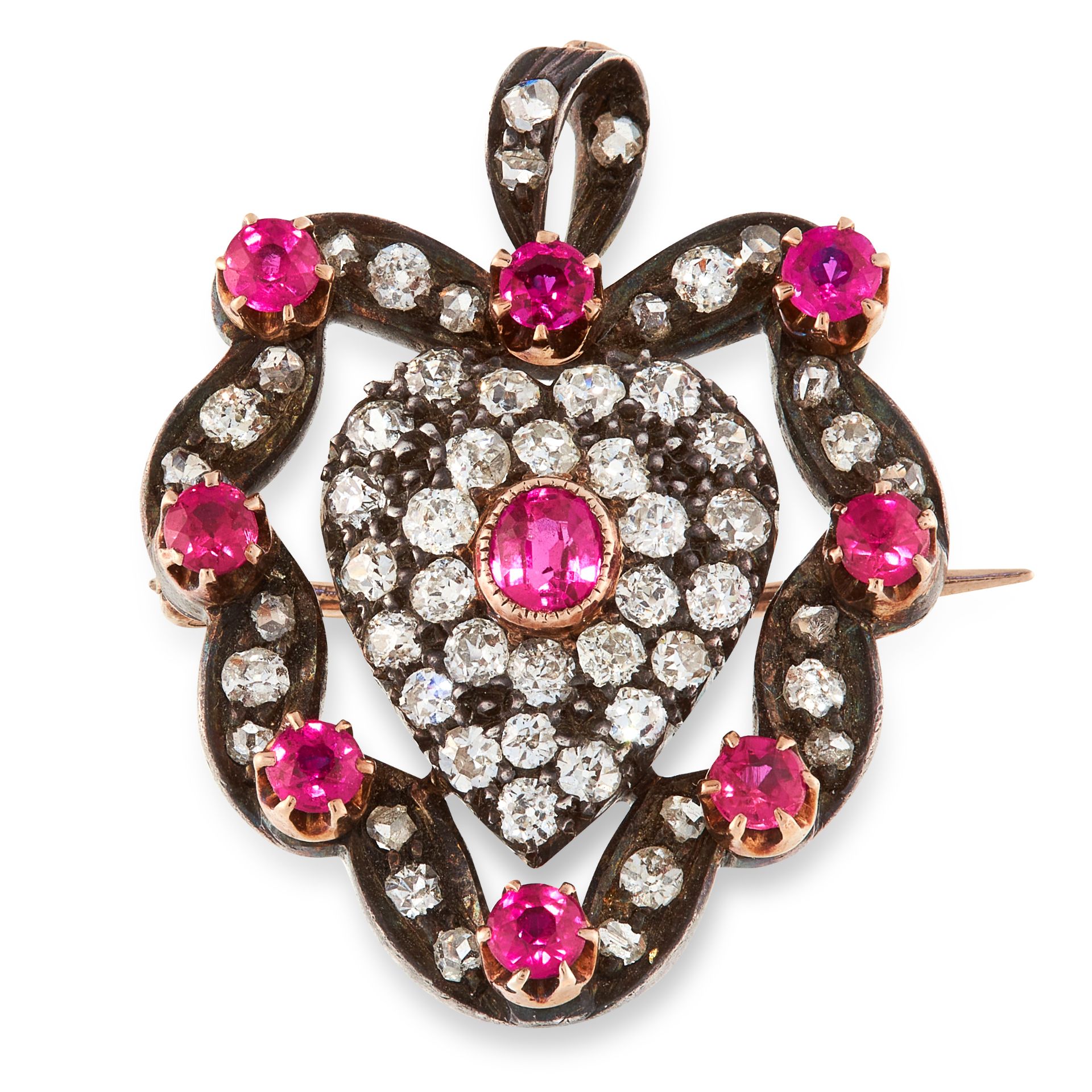 AN ANTIQUE RUBY AND DIAMOND SWEETHEART PENDANT / BROOCH in yellow gold and silver, designed as a