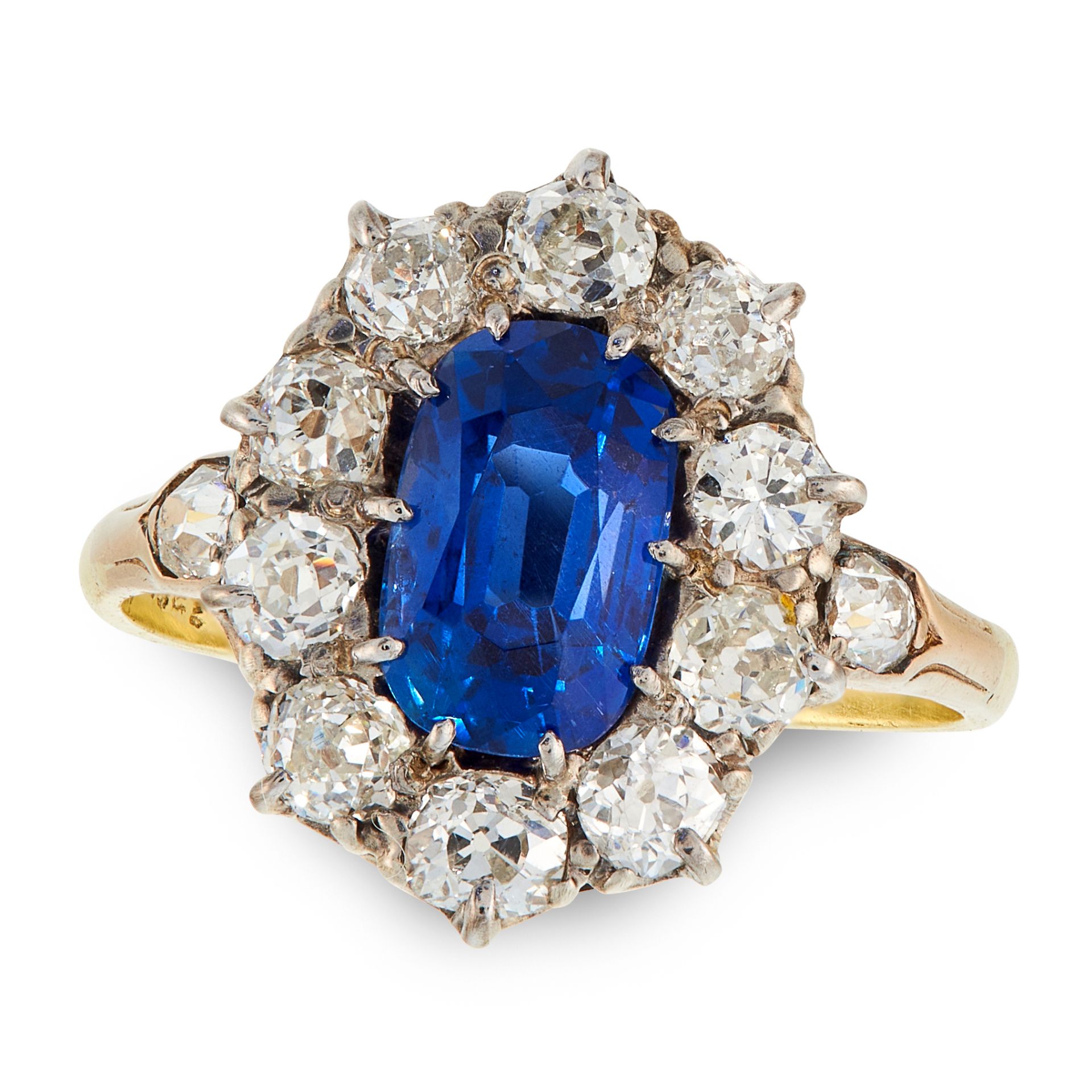 A BURMA NO HEAT SAPPHIRE AND DIAMOND RING, CIRCA 1950 in 18ct yellow gold, set with a cushion cut