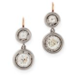 A PAIR OF DIAMOND DROP EARRINGS in circular design, each set with two old cut diamonds, totalling