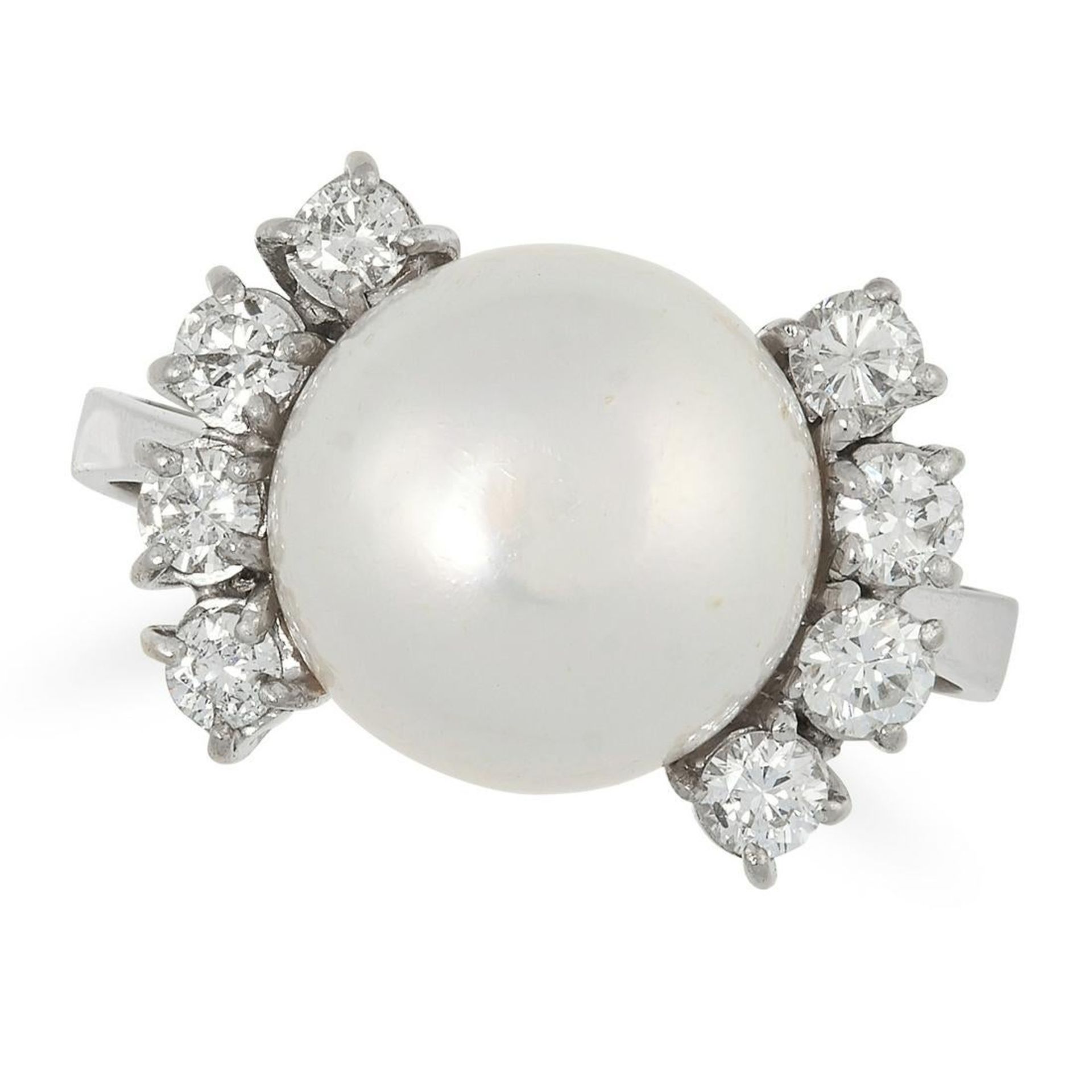 A PEARL AND DIAMOND DRESS RING set with a central pearl with wings of four round brilliant cut