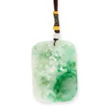 A JADEITE JADE PENDANT the body formed of a carved and polished plaque of jadeite depicting