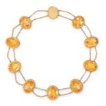 AN ANTIQUE CITRINE NECKLACE, 19TH CENTURY in yellow gold, formed of nine graduated oval cut