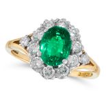 AN EMERALD AND DIAMOND CLUSTER RING in 18ct yellow gold, set with an oval cut emerald 1.31 carats