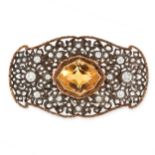 A CITRINE AND DIAMOND BROOCH in yellow gold and silver, set with a fancy shape mixed cut citrine
