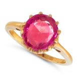 A SYNTHETIC RUBY DRESS RING, EARLY 20TH CENTURY in yellow gold, set with an oval cut synthetic