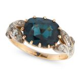 A BLUE SPINEL AND DIAMOND RING in 18ct yellow and white gold, set with an oval cut greenish-blue