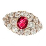 AN ANTIQUE UNHEATED RUBY AND DIAMOND RING in 18ct yellow gold, set with a cushion cut ruby of 0.65