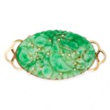 A JADEITE JADE BROOCH, CIRCA 1930 in 14ct yellow gold, set with an oval jadeite plaque carved to