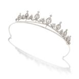 A DIAMOND TIARA in white gold and silver, designed as a row of seven graduated navette motifs