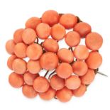 AN ANTIQUE CORAL BANGLE AND BROOCH comprising of a bangle set all over with coral beads and a