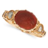 AN ANTIQUE CARNELIAN INTAGLIO AND DIAMOND RING, 19TH CENTURY in yellow gold, the face set with an