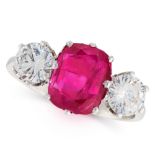 A BURMA NO HEAT RUBY AND DIAMOND THREE STONE RING set with a cushion cut ruby of 2.96 carats between