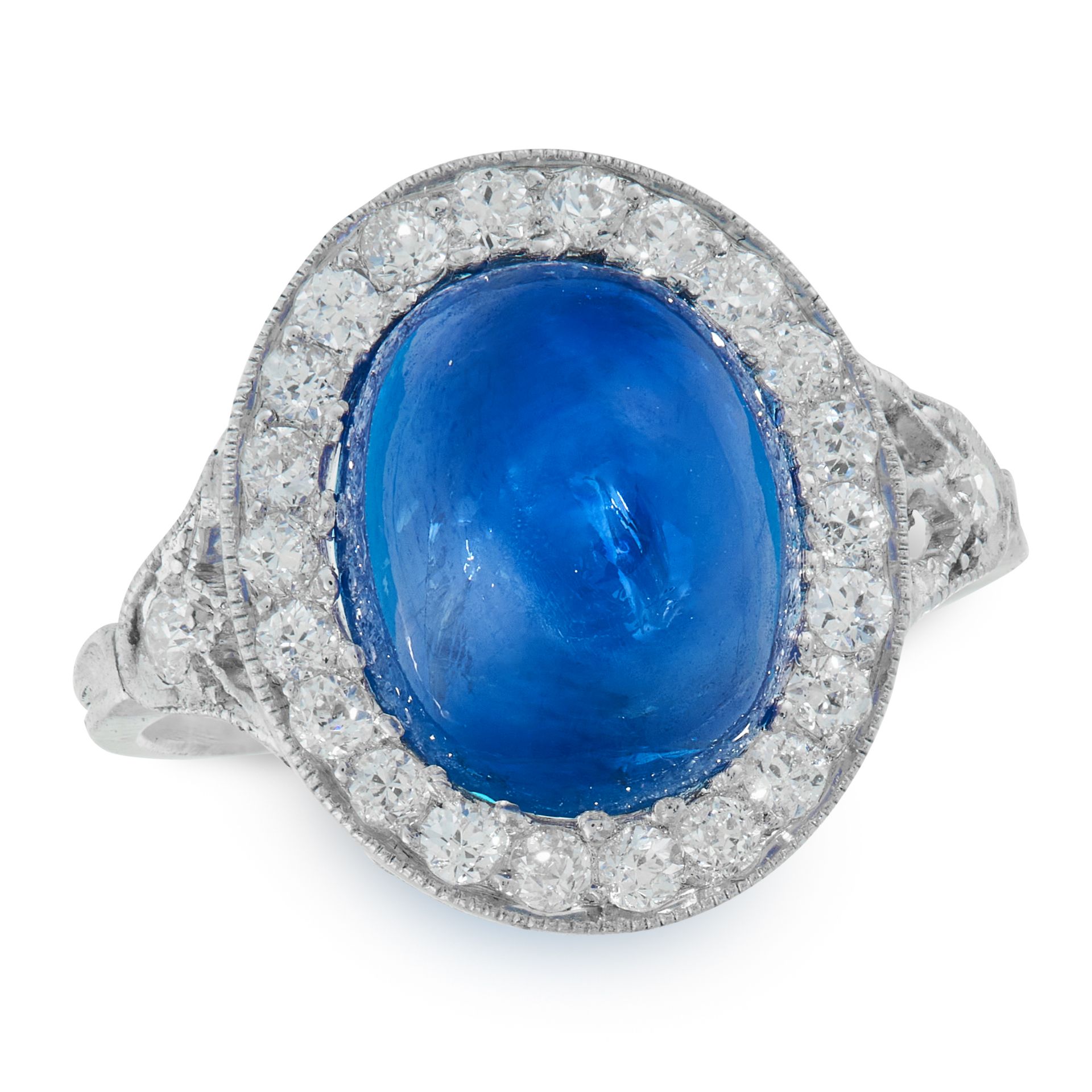 A SAPPHIRE AND DIAMOND CLUSTER RING in platinum, set with an oval cabochon sapphire of 8.49 carats