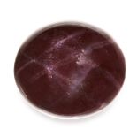 AN UNMOUNTED STAR GARNET oval cabochon cut of 139 carats, 27.8g.