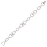 A VINTAGE DIAMOND BRACELET in platinum, comprising of alternating triangular and oval fancy links,