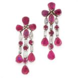 A PAIR OF RUBY AND DIAMOND EARRINGS in 18ct white gold, each designed as a cluster of four pear