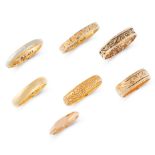 SEVEN ANTIQUE AND LATER WEDDING BAND RINGS in 18ct and 22ct yellow gold, and platinum, three bands