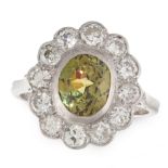 A DEMANTOID GARNET AND DIAMOND CLUSTER RING in 18ct yellow gold, set with an oval cut demantoid