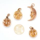 A SET OF FIVE ASSORTED MOON CHARMS comprising of three round moon face charms, a crescent moon charm