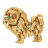 A VINTAGE RUBY AND EMERALD LION BROOCH in yellow gold, designed as a lion set with round cut ruby