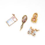 A SET OF FOUR ANTIQUE ENAMEL CHARMS in yellow gold, comprising of an enamelled chair, hand mirror,