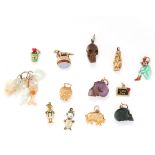 A MIXED LOT OF CHARMS comprising of carved hard stone skulls, assorted carved shell charms, five